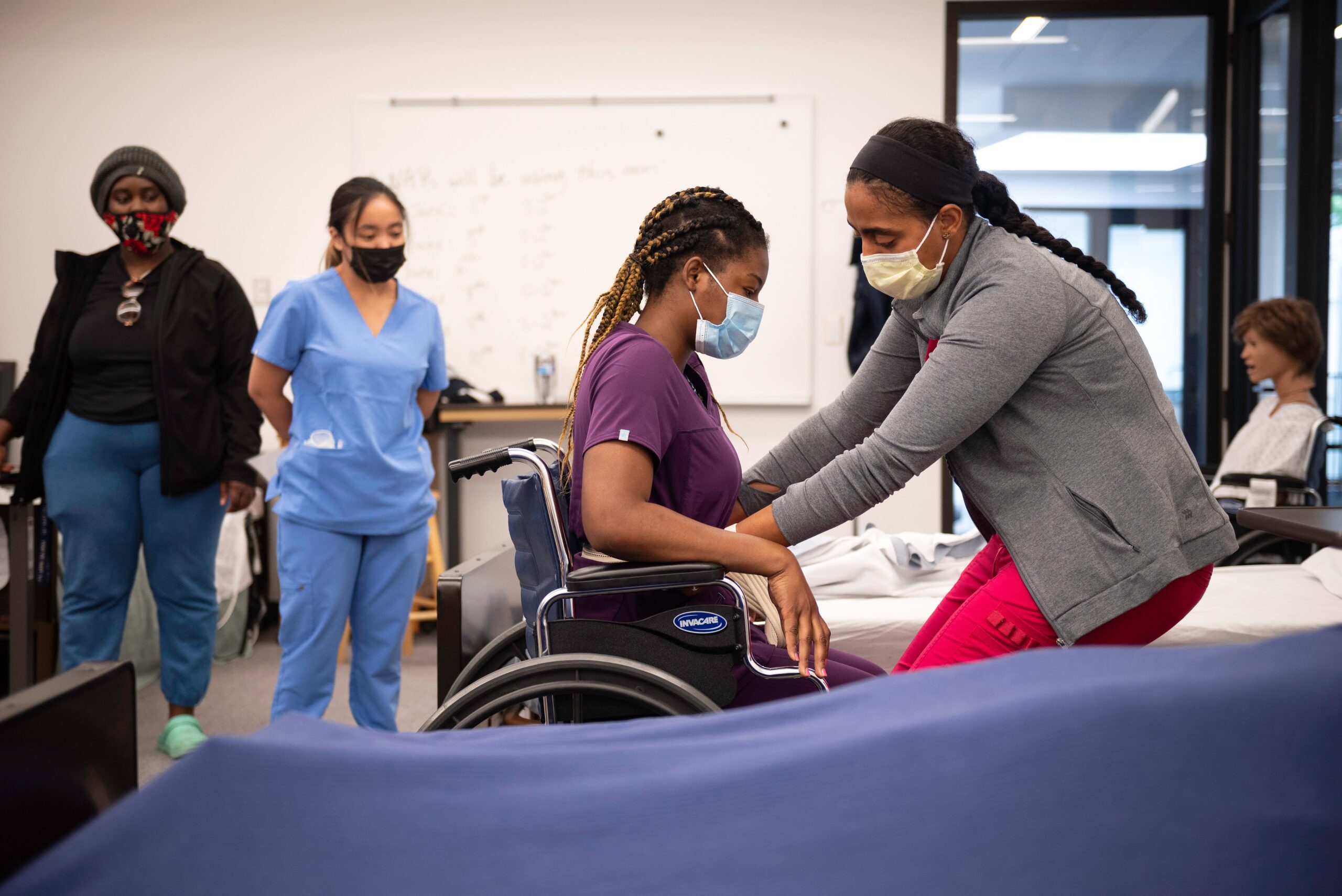Students learning nursing skills